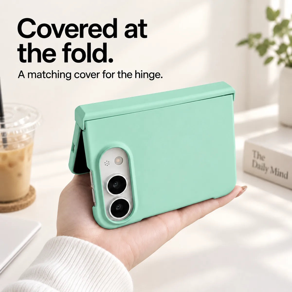 Light Green iPhone Ultra case held partly folded, showing the matching cover along the hinge. #color_Seafoam Green