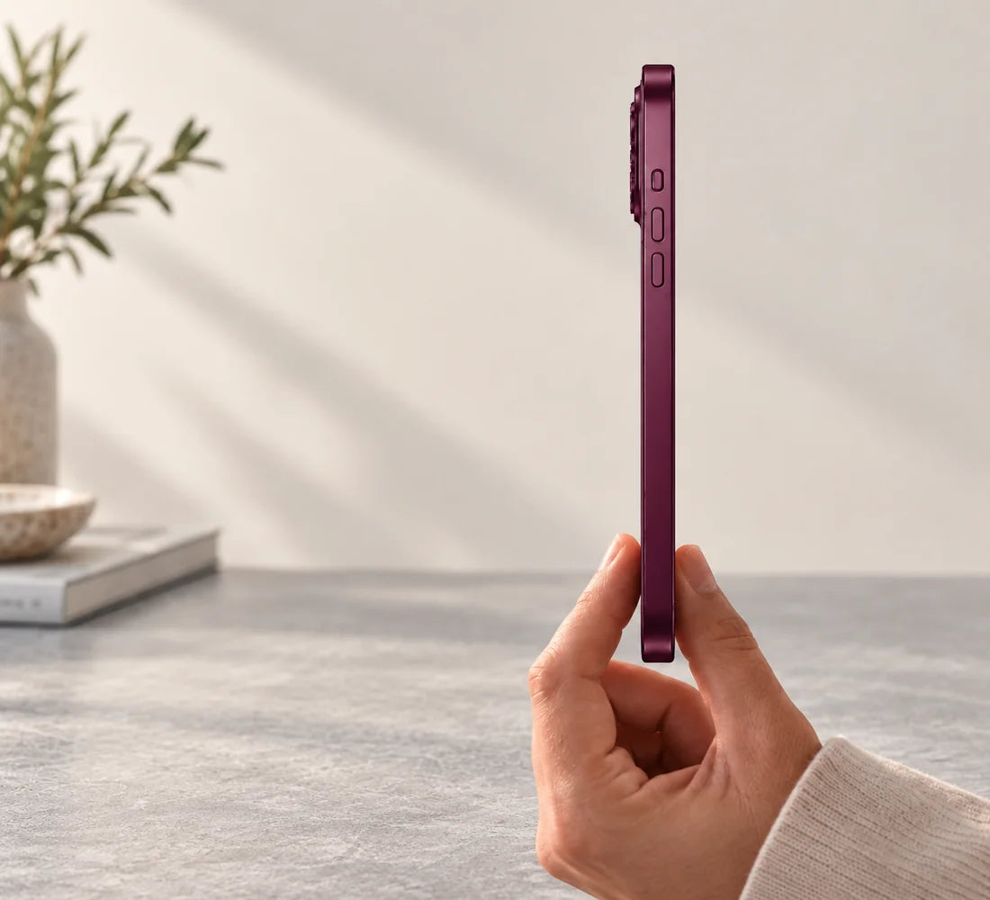 Side view of a dark cherry metal phone case showing its slim frame and side buttons.