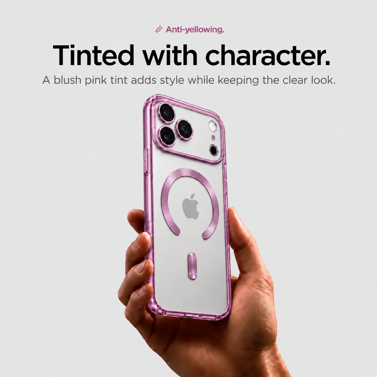 Pink tinted magnetic phone case held upright in one hand #color_Blush Pink