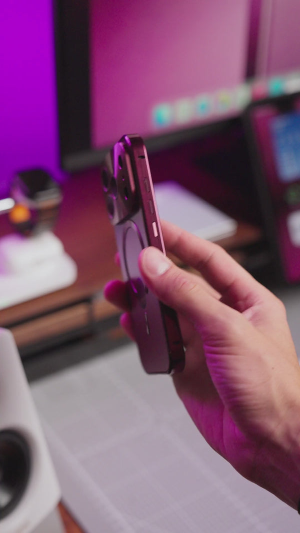 Close views of the burgundy metal phone case frame, camera guard and precise cutouts
